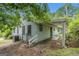 Exterior view of the home with wood siding at 4705 Ernest Dr, Forest Park, GA 30297