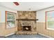 Close-up of living room stone fireplace providing a focal point to the area at 4705 Ernest Dr, Forest Park, GA 30297