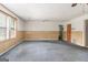 Large living room featuring wood paneling and lots of space, perfect for entertaining or relaxing at 4705 Ernest Dr, Forest Park, GA 30297