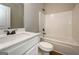 Bathroom features shower-tub combo and modern vanity at 6005 Crowley Dr, Douglasville, GA 30135