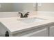 Bathroom features white vanity with a white countertop, dark fixtures, and a mirror at 6005 Crowley Dr, Douglasville, GA 30135