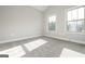 Bright bedroom with two windows allowing for ample natural light at 6005 Crowley Dr, Douglasville, GA 30135