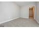Cozy bedroom features light walls, neutral carpeting, and access to an adjacent room at 6005 Crowley Dr, Douglasville, GA 30135