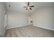 Open bedroom featuring carpet flooring, neutral walls, and natural light from a window at 6005 Crowley Dr, Douglasville, GA 30135