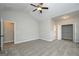 Bright bedroom features carpet flooring, vaulted ceiling, a ceiling fan, and spacious closets at 6005 Crowley Dr, Douglasville, GA 30135