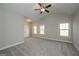 Large bedroom featuring plush carpet, ceiling fan, and bright natural light at 6005 Crowley Dr, Douglasville, GA 30135