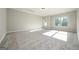 Bright, bonus room features plush neutral carpeting and natural light from multiple windows at 6005 Crowley Dr, Douglasville, GA 30135