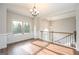 Elegant dining room with hardwood floors, large window, and classic wainscoting at 6005 Crowley Dr, Douglasville, GA 30135