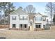 Charming two-story home featuring stone accents, shutters, and a welcoming front porch at 6005 Crowley Dr, Douglasville, GA 30135