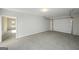 Spacious garage with concrete floor, white walls, and large garage door at 6005 Crowley Dr, Douglasville, GA 30135
