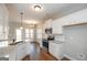 Bright kitchen with stainless steel appliances, white cabinetry, and hardwood flooring at 6005 Crowley Dr, Douglasville, GA 30135