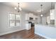 Modern eat-in kitchen featuring white cabinets, stainless steel appliances, and hardwood floors at 6005 Crowley Dr, Douglasville, GA 30135
