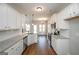 Spacious kitchen with white cabinets, stainless steel appliances, and hardwood floors at 6005 Crowley Dr, Douglasville, GA 30135