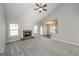 Bright living room with fireplace, neutral walls and carpet, with an open floorplan at 6005 Crowley Dr, Douglasville, GA 30135