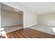 Open-concept living room with hardwood flooring and neutral carpeting in an adjacent room at 6005 Crowley Dr, Douglasville, GA 30135
