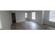 Bright living room with hardwood floors and multiple windows, offering lots of natural light at 3484 Enterkin Ln, South Fulton, GA 30349