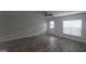Spacious living room featuring hardwood floors, neutral walls, and plenty of natural light at 3484 Enterkin Ln, South Fulton, GA 30349