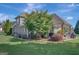 Expansive backyard with a patio, mature trees, and lush landscaping surrounding the home at 9 Warrior Way, Sharpsburg, GA 30277