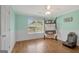 Bedroom with hardwood floors, a window, ceiling fan and white walls at 9 Warrior Way, Sharpsburg, GA 30277