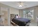 Bedroom featuring a bed, ceiling fan, natural light, and an attached bathroom at 9 Warrior Way, Sharpsburg, GA 30277