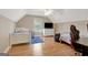 Finished bedroom with light hardwood floors, a window, and two twin beds at 9 Warrior Way, Sharpsburg, GA 30277