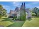 Charming home with a well-maintained lawn, mature trees, and manicured landscaping at 9 Warrior Way, Sharpsburg, GA 30277