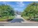 Charming home exterior with a well-manicured lawn, concrete driveway, and gray facade at 9 Warrior Way, Sharpsburg, GA 30277