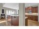 A kitchen showcases stainless steel appliances, granite countertops, and warm wood cabinets at 9 Warrior Way, Sharpsburg, GA 30277