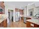 Modern kitchen with granite countertops, stainless steel appliances, and wood cabinets at 9 Warrior Way, Sharpsburg, GA 30277