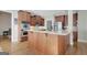 A kitchen showcases stainless steel appliances, granite countertops, and warm wood cabinets at 9 Warrior Way, Sharpsburg, GA 30277