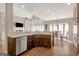 Bright kitchen featuring stainless steel appliances, wood cabinets and granite countertops at 9 Warrior Way, Sharpsburg, GA 30277
