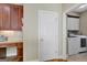 Well-equipped laundry room showcasing modern washer and dryer units, as well as ample cabinet space at 9 Warrior Way, Sharpsburg, GA 30277