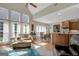 Spacious living area with a view of the dining area and kitchen, creating an open and inviting atmosphere at 9 Warrior Way, Sharpsburg, GA 30277