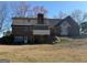 Exterior home view featuring a garage, a mix of brick and siding, plus a sunroom with great natural light at 291 Morgan Mill Rd, Brooks, GA 30205