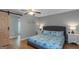 This primary bedroom boasts lots of light and a modern barn door to the en suite bathroom at 308 Larkspur Turn, Peachtree City, GA 30269