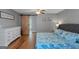Bright and cheery bedroom featuring a sliding barn door, decorative artwork, and ample natural light at 308 Larkspur Turn, Peachtree City, GA 30269