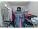 Organized closet with clothes and storage shelves for efficient and stylish storage solutions at 308 Larkspur Turn, Peachtree City, GA 30269