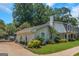 A charming home featuring manicured landscaping and an attached garage with a gated driveway at 308 Larkspur Turn, Peachtree City, GA 30269