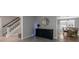 Elegant foyer with staircase, stylish console table, mirror, and dining room view for a welcoming entrance at 308 Larkspur Turn, Peachtree City, GA 30269