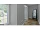 Neutral hallway with hardwood floors, modern decor and ample sunlight at 308 Larkspur Turn, Peachtree City, GA 30269