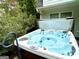 Inviting hot tub surrounded by landscaping and lush greenery at 308 Larkspur Turn, Peachtree City, GA 30269
