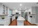 Updated kitchen featuring white cabinets, stainless appliances, and a central island at 308 Larkspur Turn, Peachtree City, GA 30269