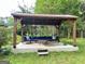 Outdoor seating area with a pergola, perfect for relaxing or entertaining at 308 Larkspur Turn, Peachtree City, GA 30269