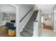 Staircase in an open floor plan, connecting the living areas and providing access to other floors at 308 Larkspur Turn, Peachtree City, GA 30269