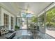 Bright sunroom featuring a casual dining area, access to outdoors, and view of the backyard at 308 Larkspur Turn, Peachtree City, GA 30269