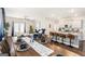 Open dining area with a stylish table set, seamlessly connecting to the modern kitchen at 12167 Conrad Cir, Hampton, GA 30228