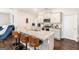 Bright kitchen with white cabinets, granite countertops, and stainless steel appliances at 12167 Conrad Cir, Hampton, GA 30228