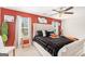 This spacious main bedroom offers ample natural light with black and white color themes at 12167 Conrad Cir, Hampton, GA 30228