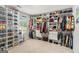 Large walk-in closet with built-in shelving and hanging rods for optimal organization and storage at 12167 Conrad Cir, Hampton, GA 30228