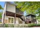 Exterior elevation of the house with a screened-in back porch at 183 Wynnmeade, Peachtree City, GA 30269